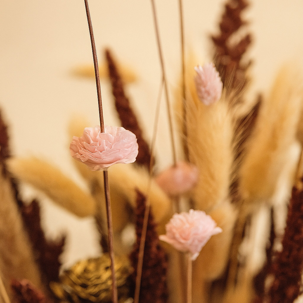 Blushing Harvest Dried Floral Arrangement featuring soft blush pinks and warm natural tones in an elegant display.